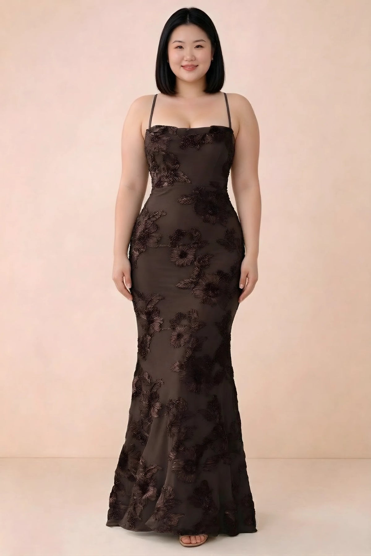 Front studio view of Belinda chocolate floral maxi dress showing the close-fitting bodice and long skirt