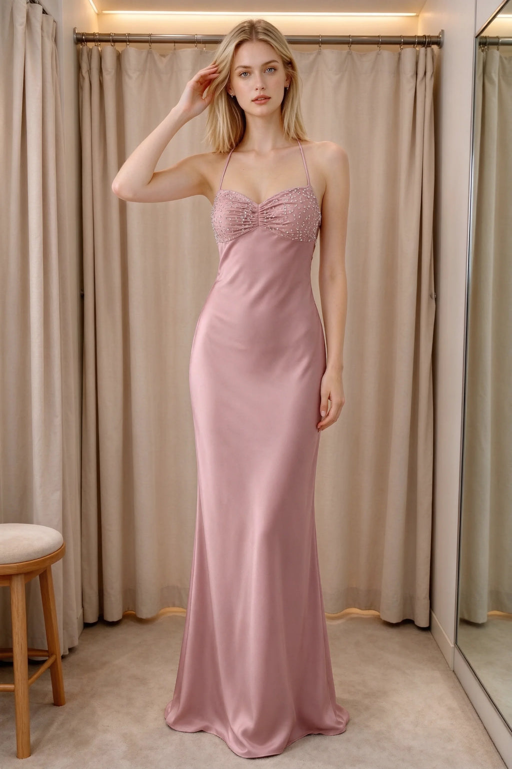 Front indoor view of Blanche dusty pink satin maxi dress beside curtains with a beaded bust panel