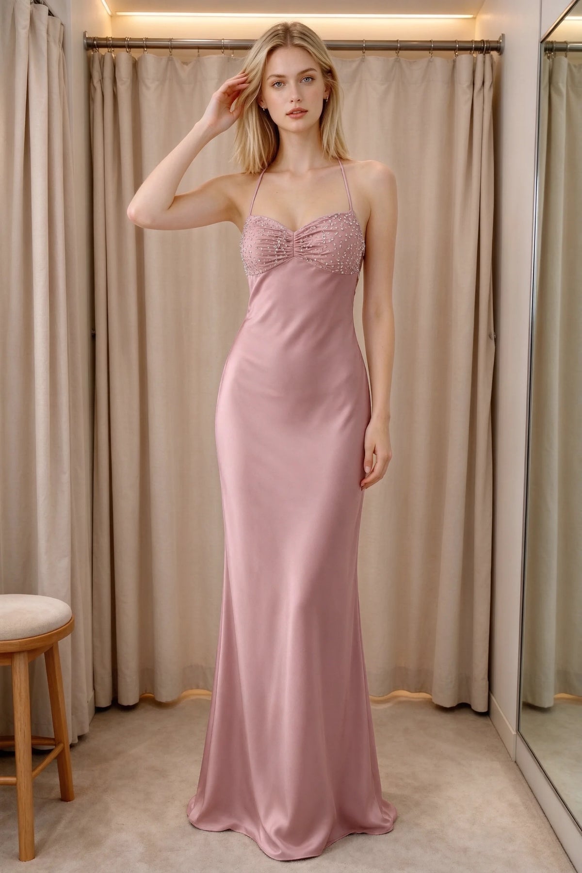 Front indoor view of Blanche dusty pink satin maxi dress beside curtains with a beaded bust panel