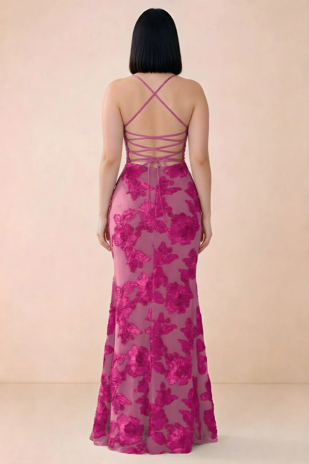 Rear studio view of Belinda fuchsia dress showing the open back and gently flared skirt