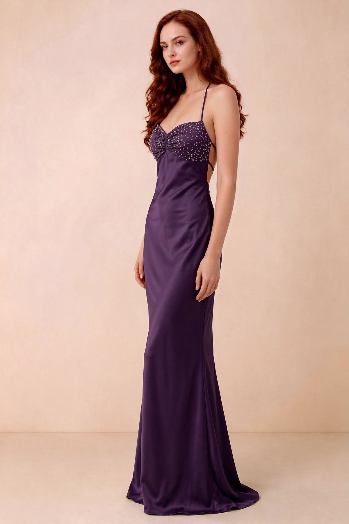 Three-quarter studio view of Blanche grape dress showing the fitted hips and flared long hem