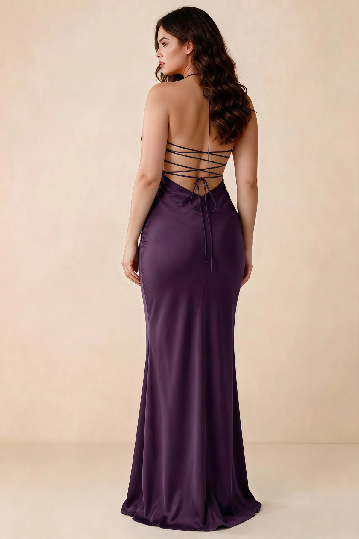 Rear studio view of Blanche grape satin dress showing the open back and mermaid silhouette