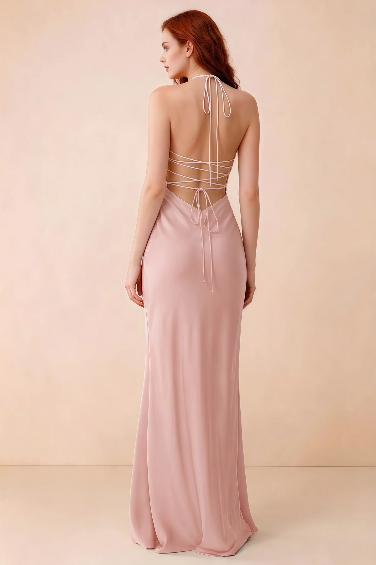 Back studio view of Blanche haze pink dress showing halter neck ties and crossed open-back lacing