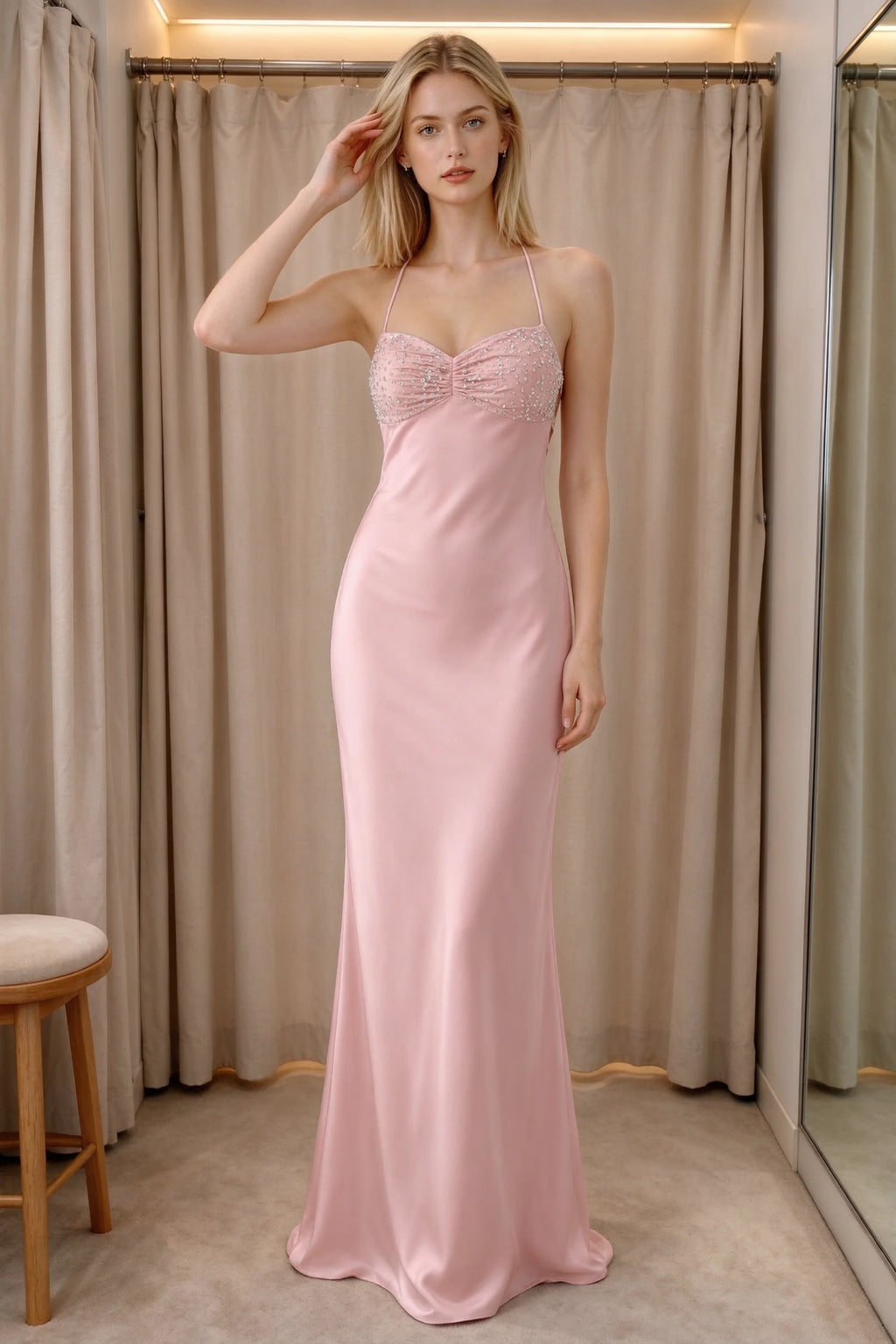 Front indoor view of Blanche haze pink satin maxi dress beside curtains with a beaded bust panel