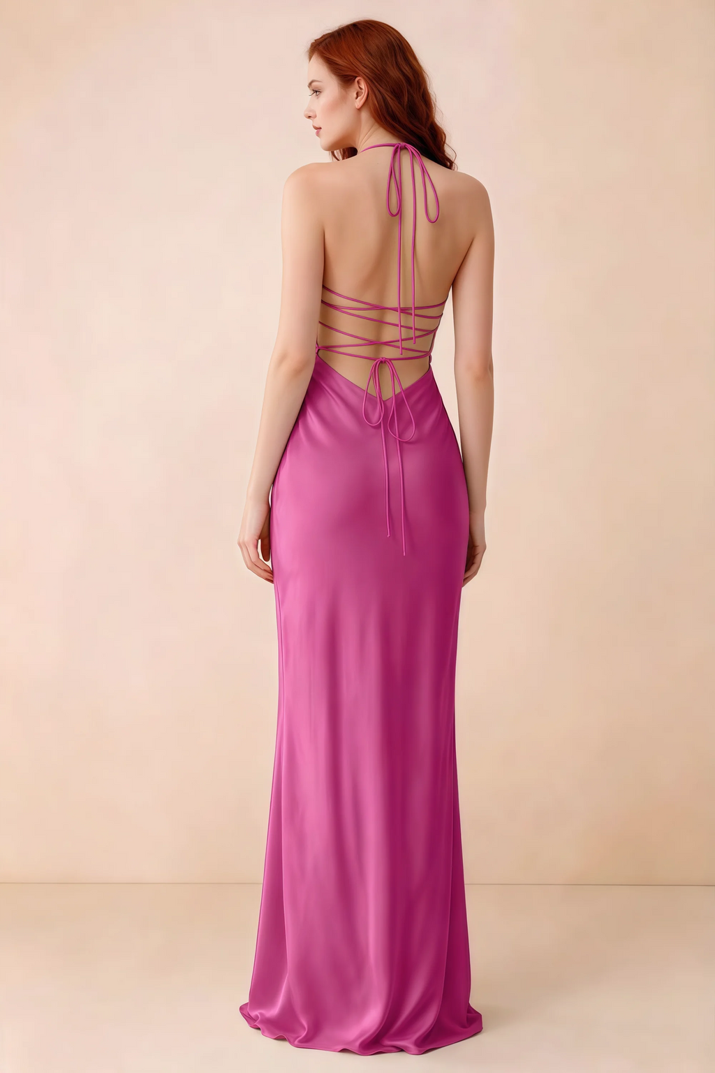 Back studio view of Blanche hot pink dress showing halter neck ties and crossed open-back lacing