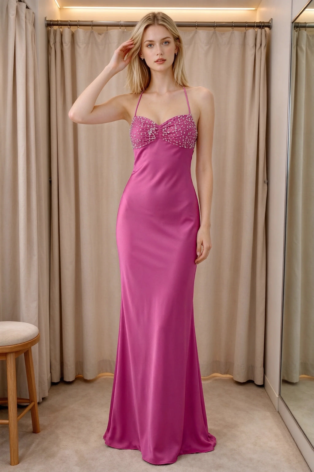 Front indoor view of Blanche hot pink satin maxi dress beside curtains with a beaded bust panel