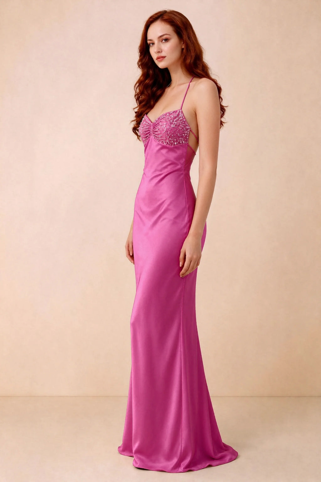 Three-quarter studio view of Blanche hot pink dress showing the fitted hips and flared long hem