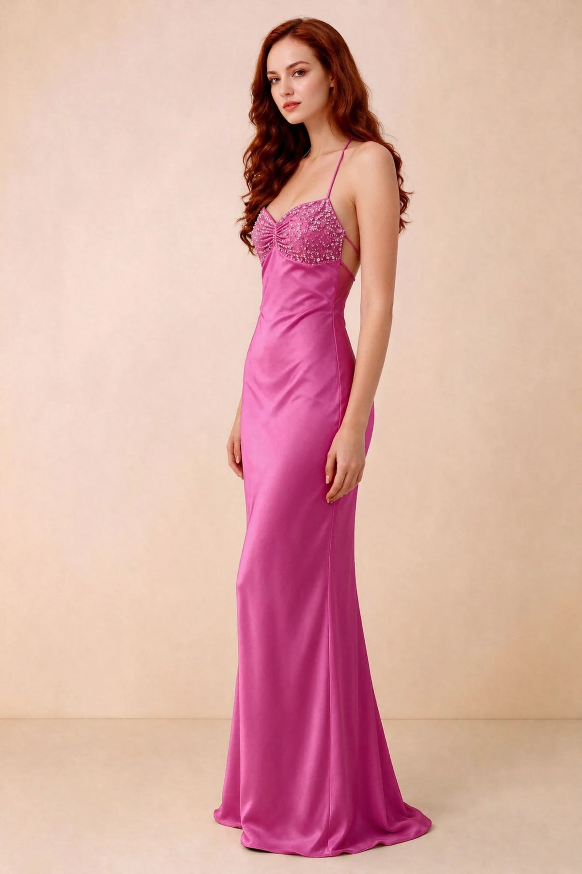 Three-quarter studio view of Blanche hot pink dress showing the fitted hips and flared long hem