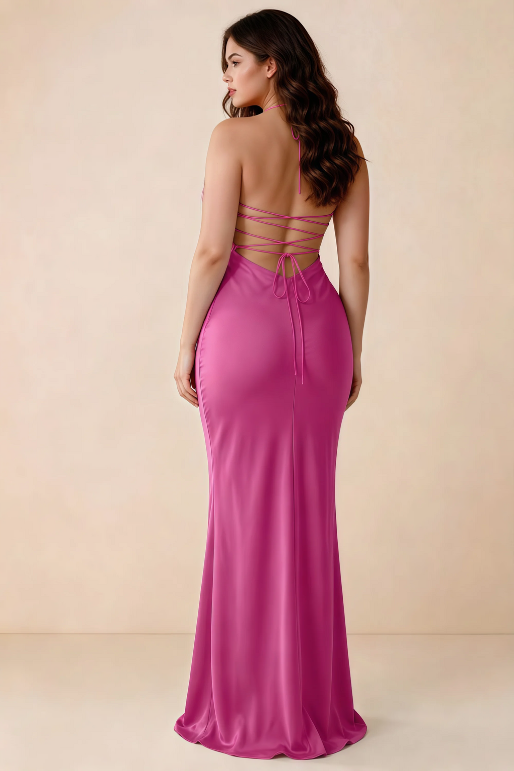 Rear studio view of Blanche hot pink satin dress showing the open back and mermaid silhouette