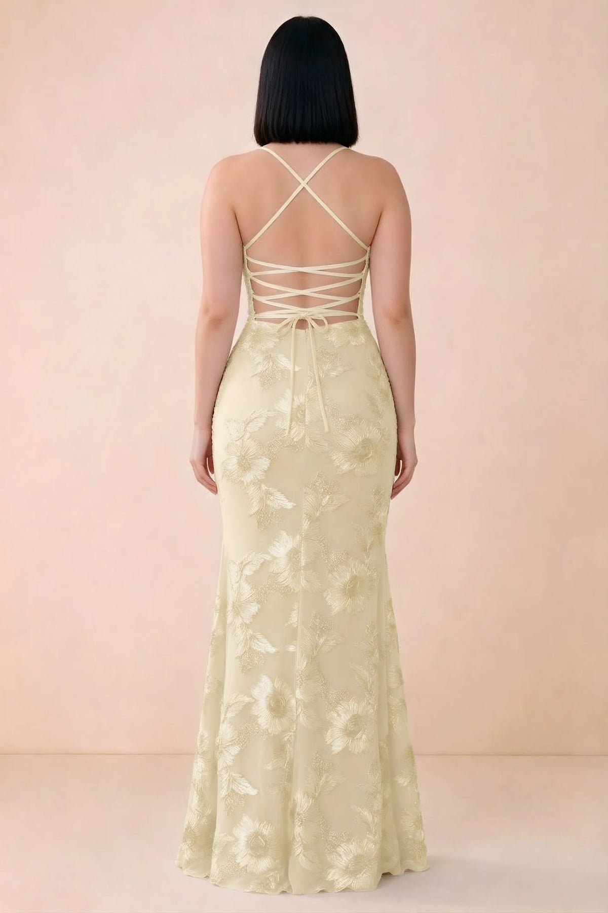 Rear studio view of Belinda lemon dress showing the open back and gently flared skirt
