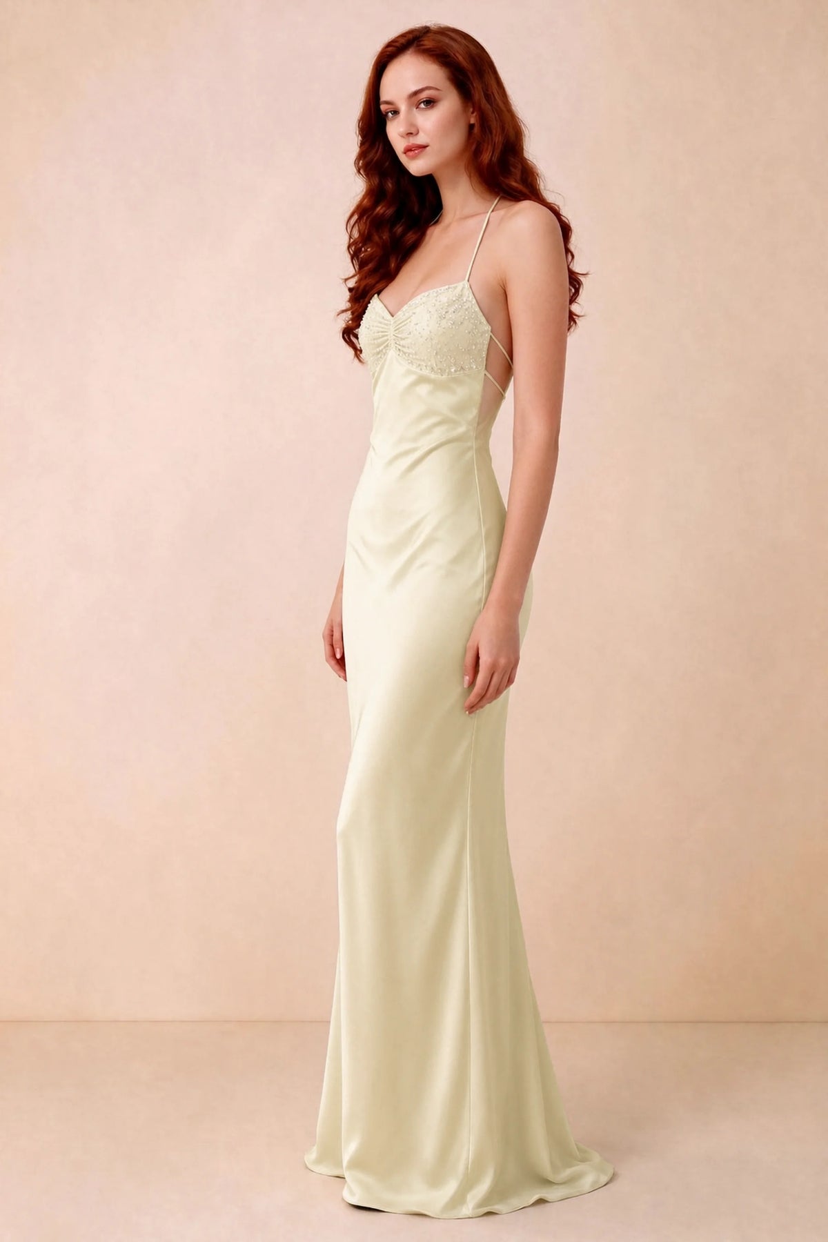Three-quarter studio view of Blanche lemon dress showing the fitted hips and flared long hem