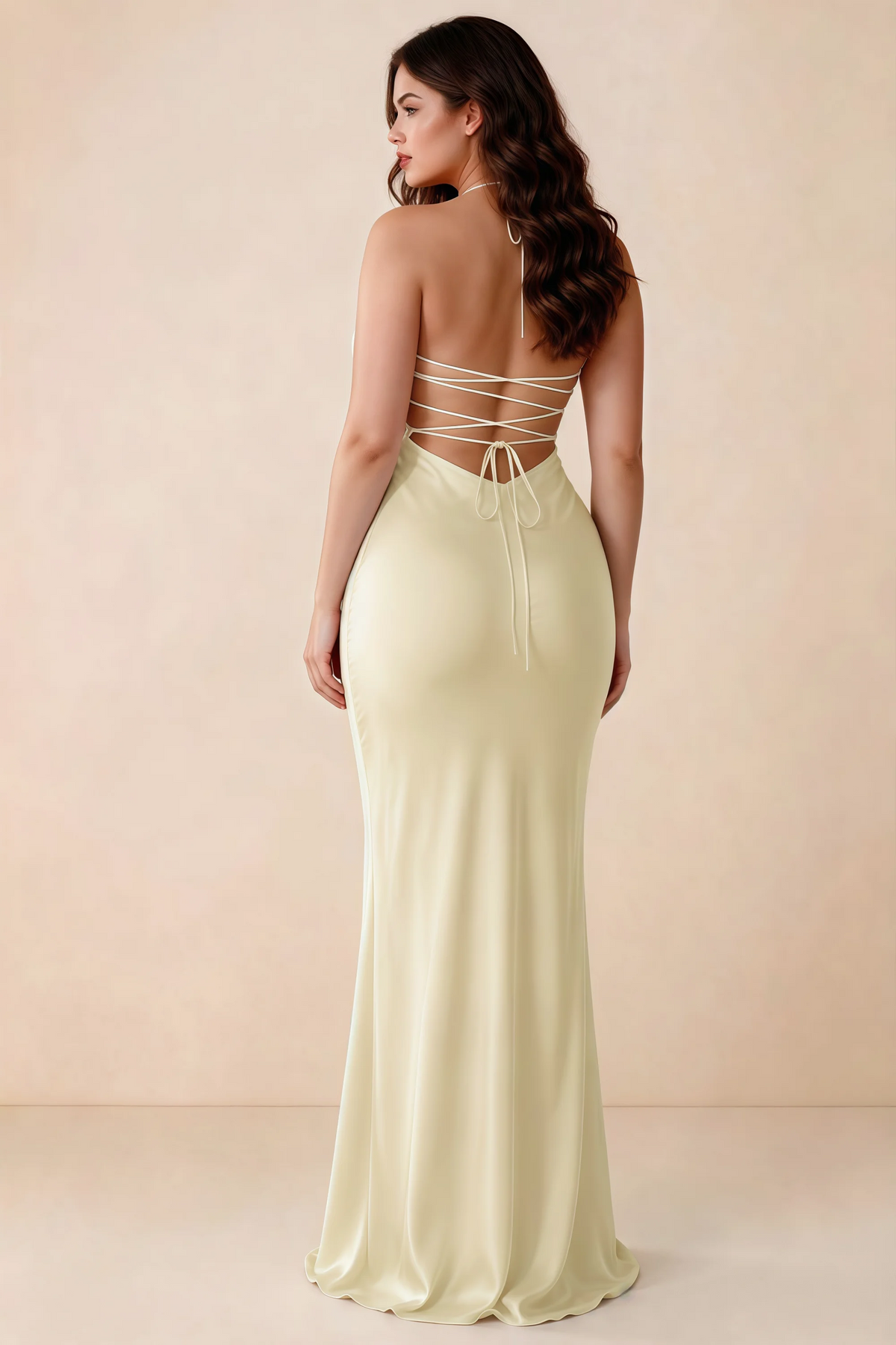 Rear studio view of Blanche lemon satin dress showing the open back and mermaid silhouette