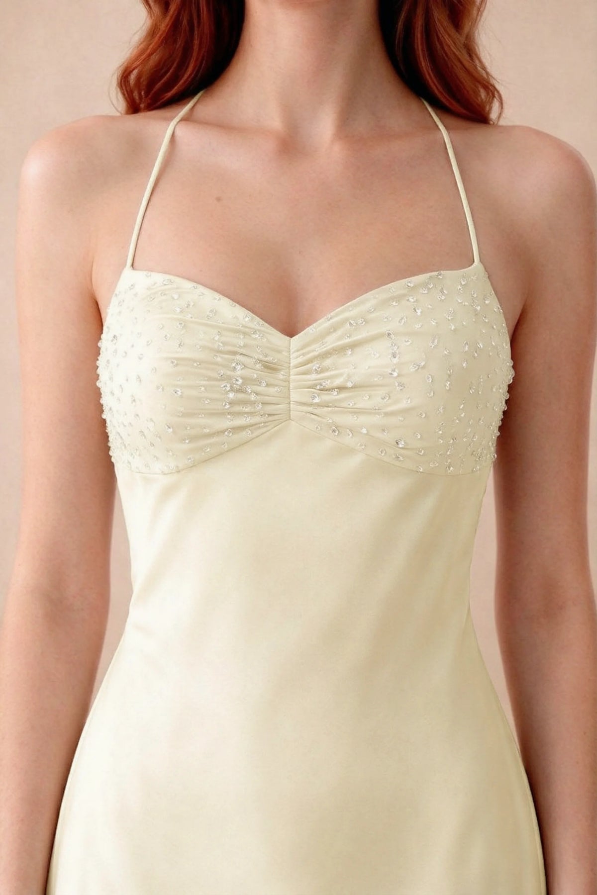 Close-up of Blanche lemon sweetheart neckline with beading, central ruching and fine halter straps