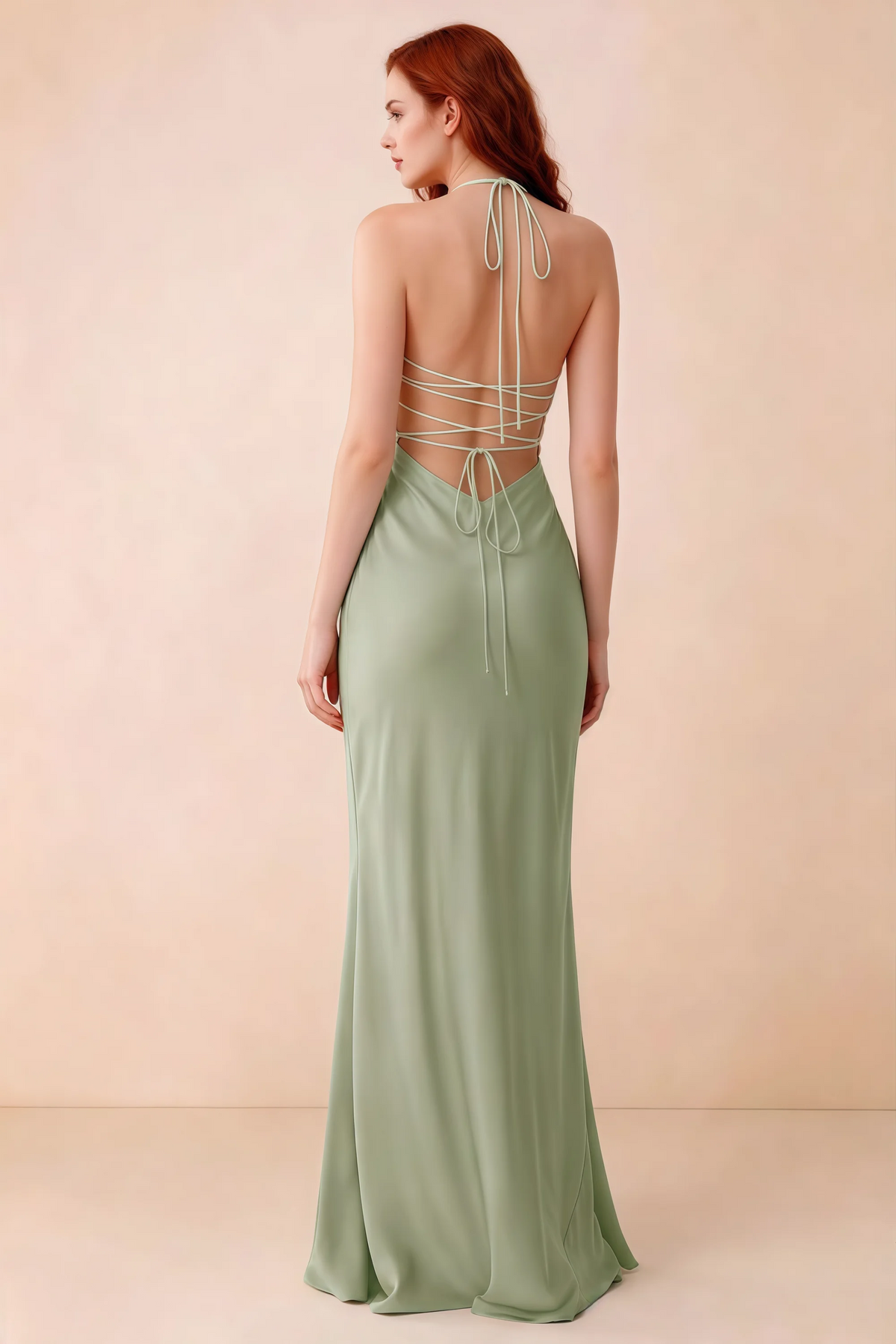 Back studio view of Blanche light green dress showing halter neck ties and crossed open-back lacing