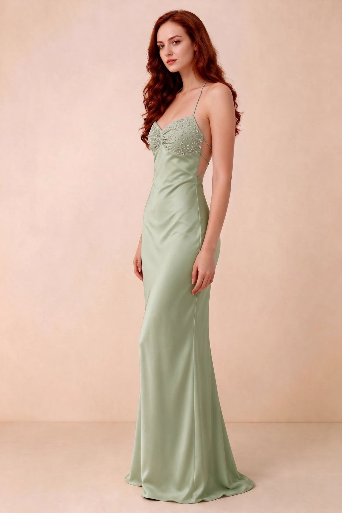 Three-quarter studio view of Blanche light green dress showing the fitted hips and flared long hem