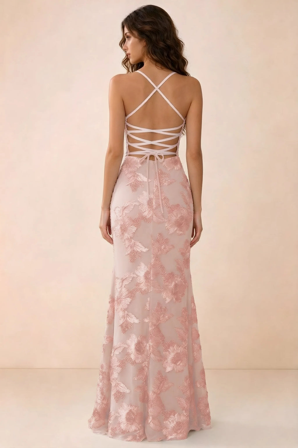 Back studio view of Belinda light pink maxi dress showing crossed straps and open-back ties