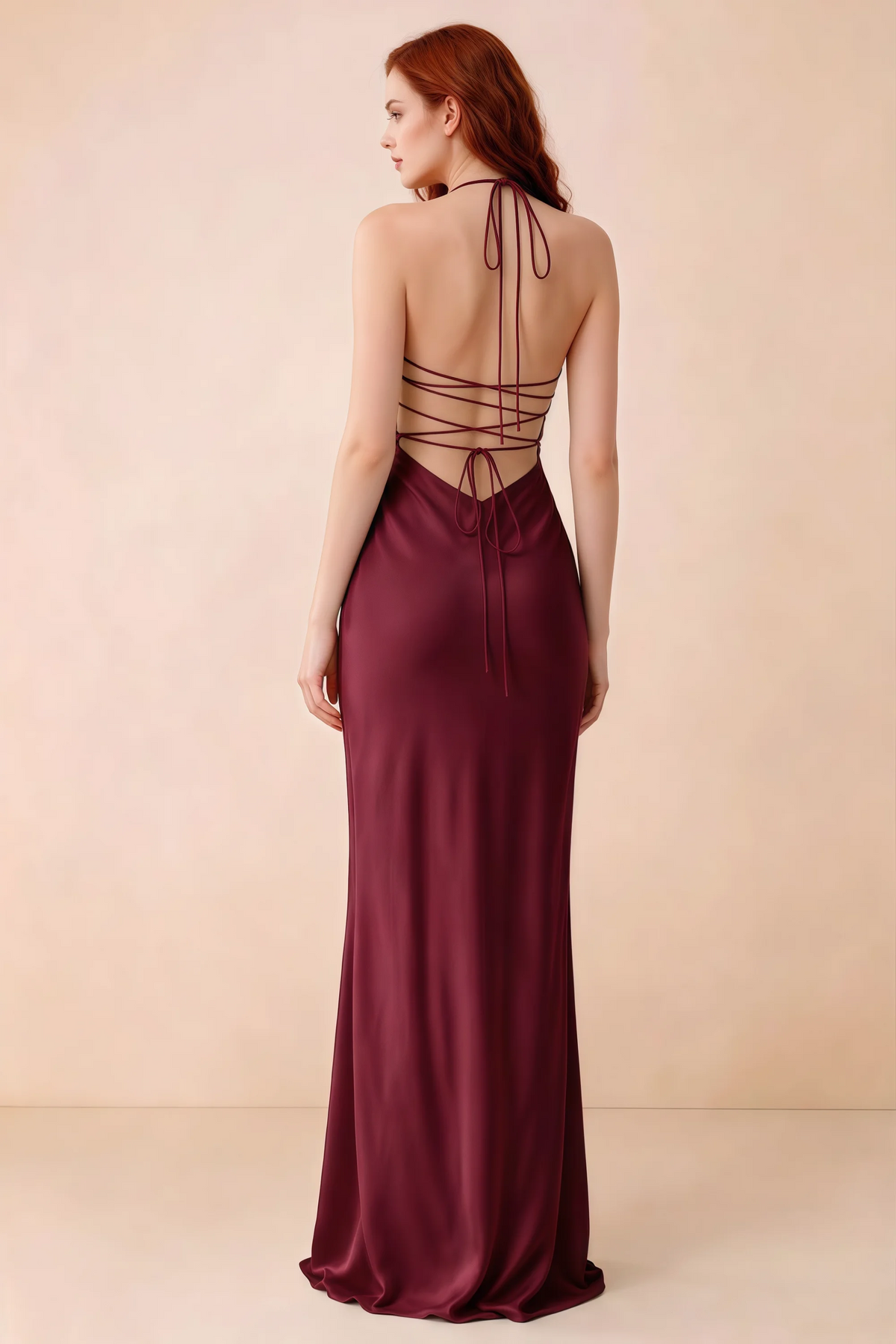 Back studio view of Blanche merlot dress showing halter neck ties and crossed open-back lacing