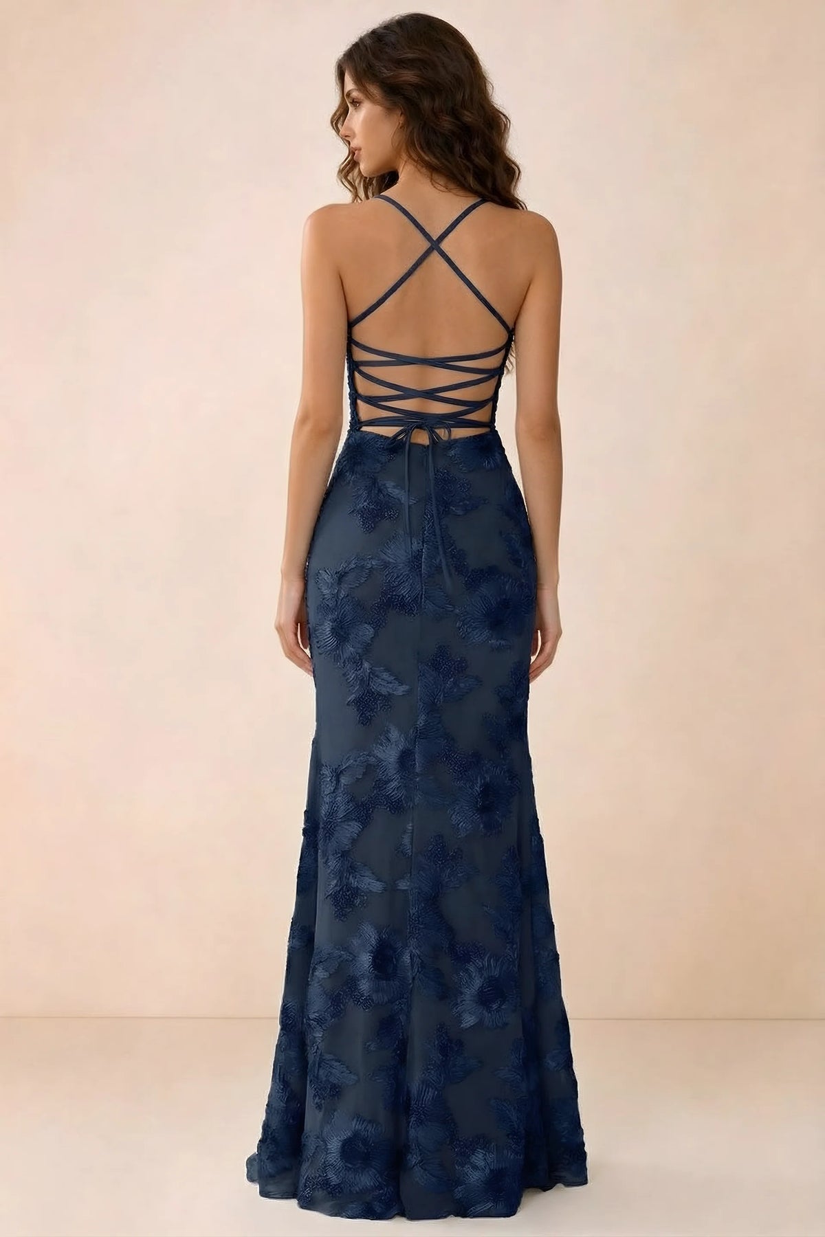 Back studio view of Belinda navy maxi dress showing crossed straps and open-back ties