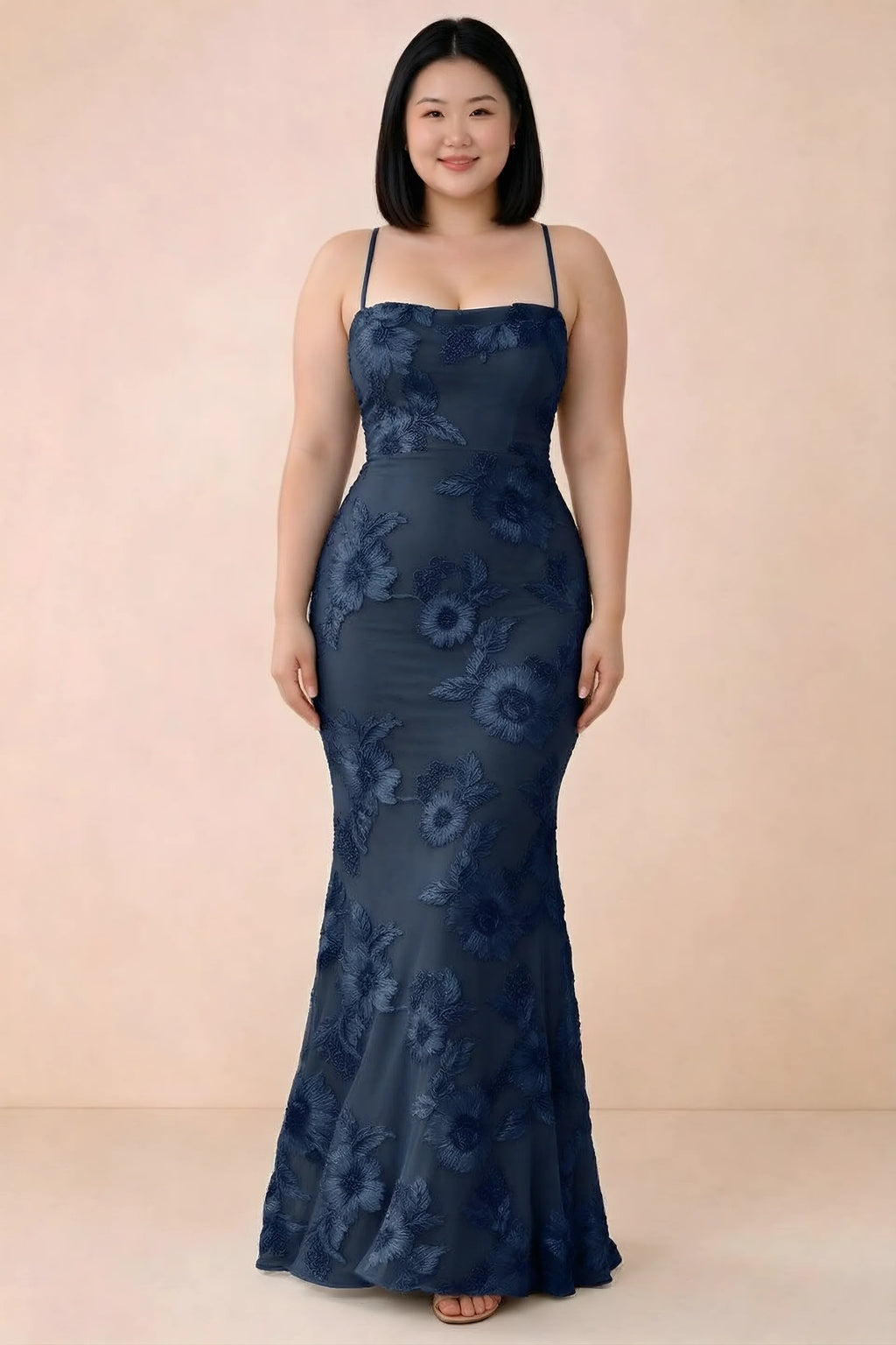 Front studio view of Belinda navy floral maxi dress showing the close-fitting bodice and long skirt