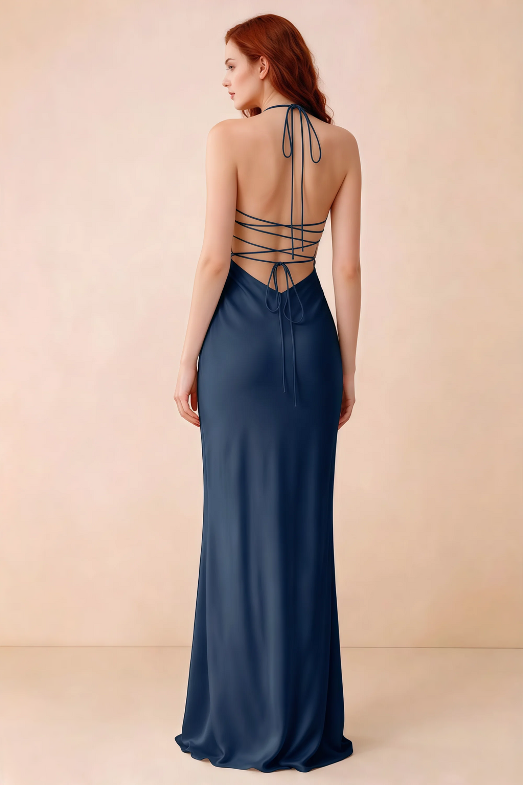 Back studio view of Blanche navy dress showing halter neck ties and crossed open-back lacing
