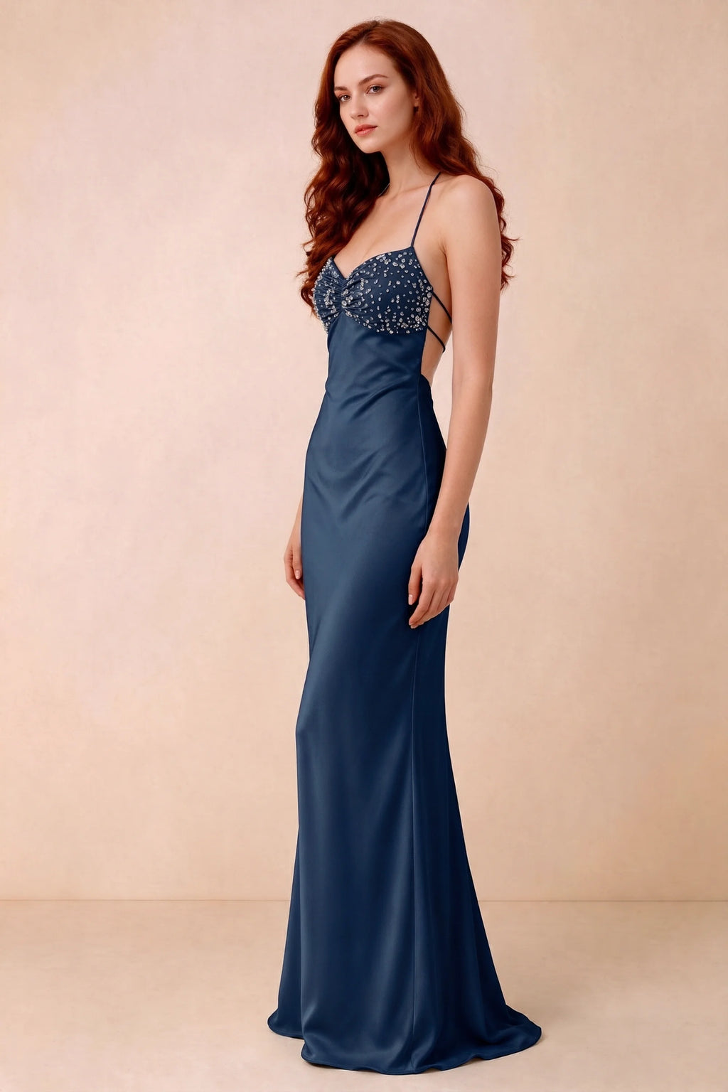 Three-quarter studio view of Blanche navy dress showing the fitted hips and flared long hem