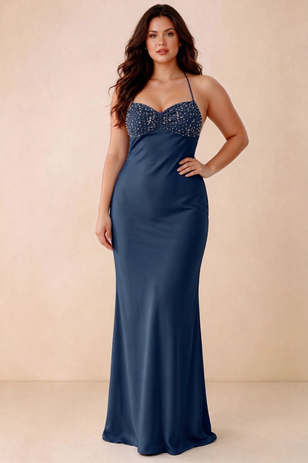 Front studio view of Blanche navy maxi dress showing the ruched beaded bodice and smooth skirt