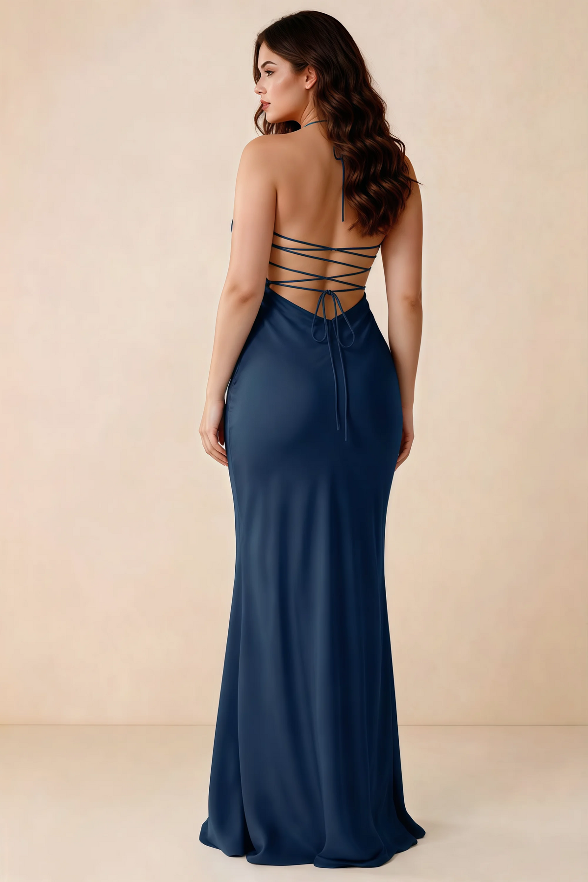 Rear studio view of Blanche navy satin dress showing the open back and mermaid silhouette