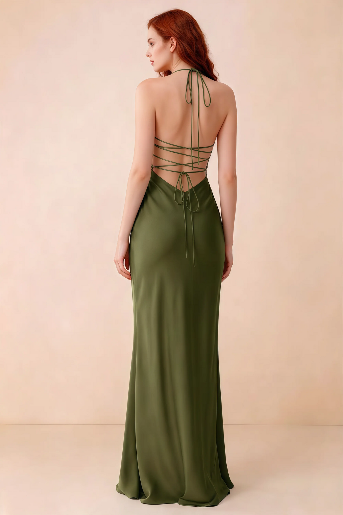 Back studio view of Blanche olive green dress showing halter neck ties and crossed open-back lacing