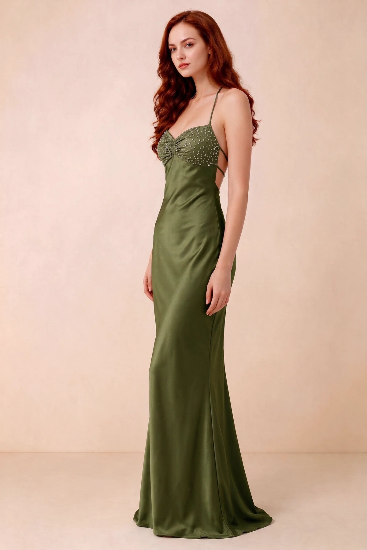 Three-quarter studio view of Blanche olive green dress showing the fitted hips and flared long hem