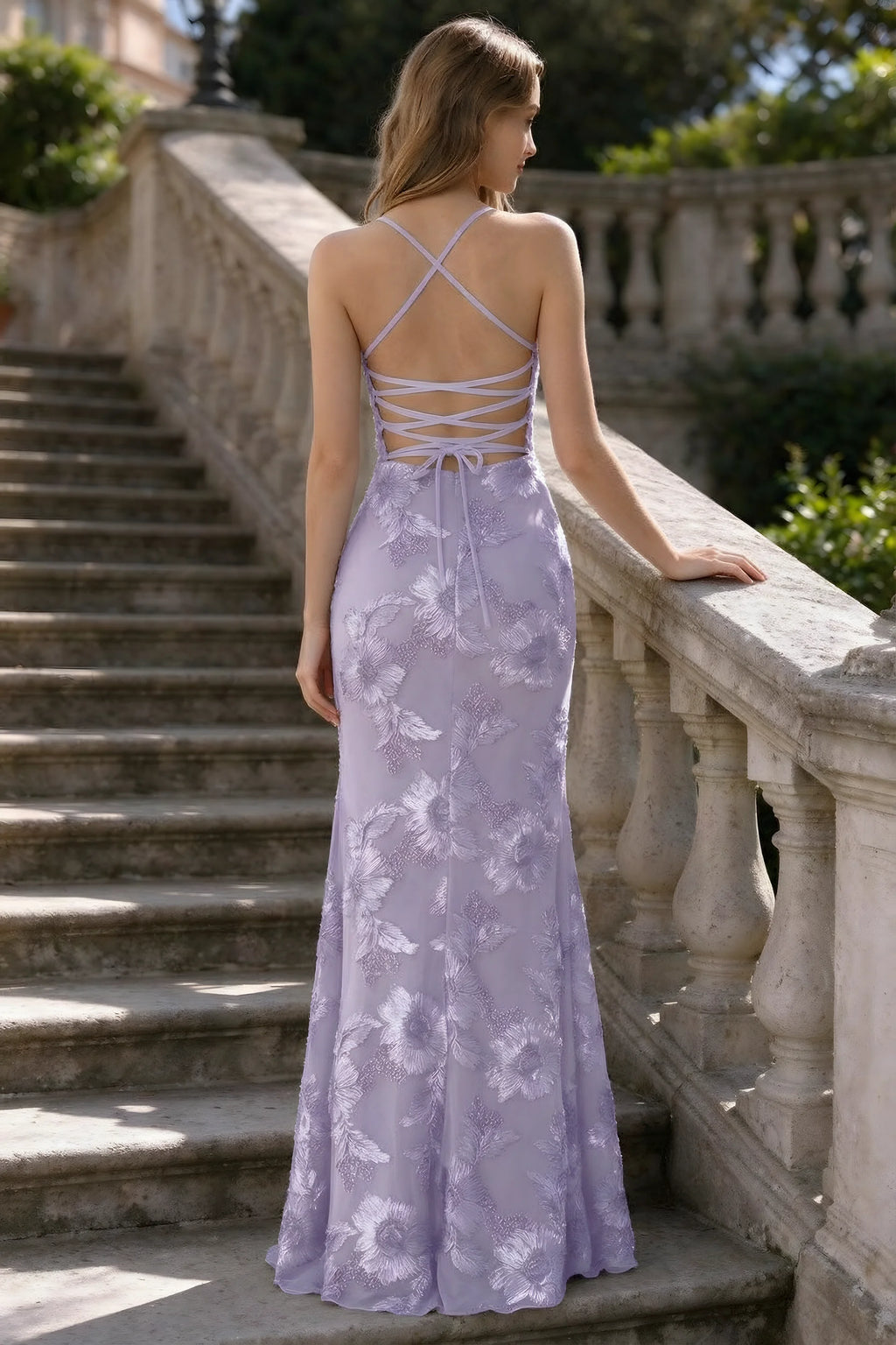 Outdoor rear view of Belinda pale purple mermaid maxi dress showing the crisscross back ties