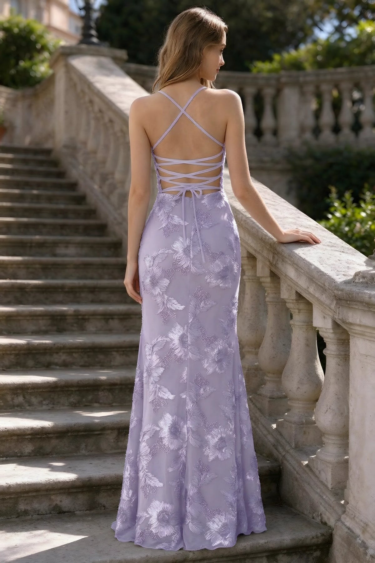 Outdoor rear view of Belinda pale purple mermaid maxi dress showing the crisscross back ties