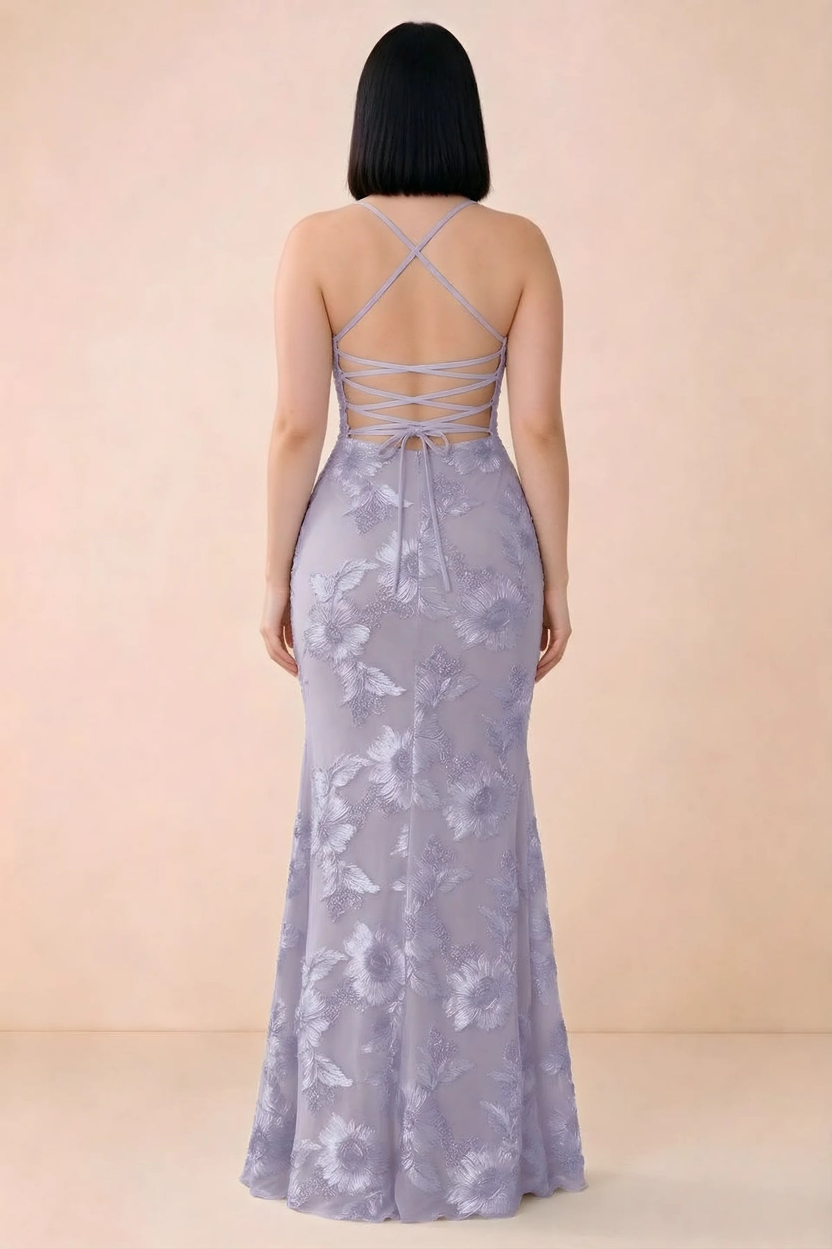 Rear studio view of Belinda pale purple dress showing the open back and gently flared skirt