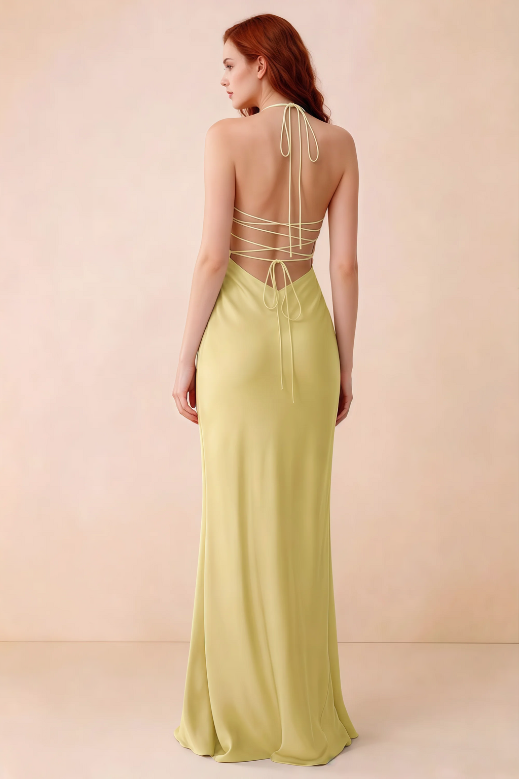 Back studio view of Blanche pastel yellow dress showing halter neck ties and crossed open-back lacing