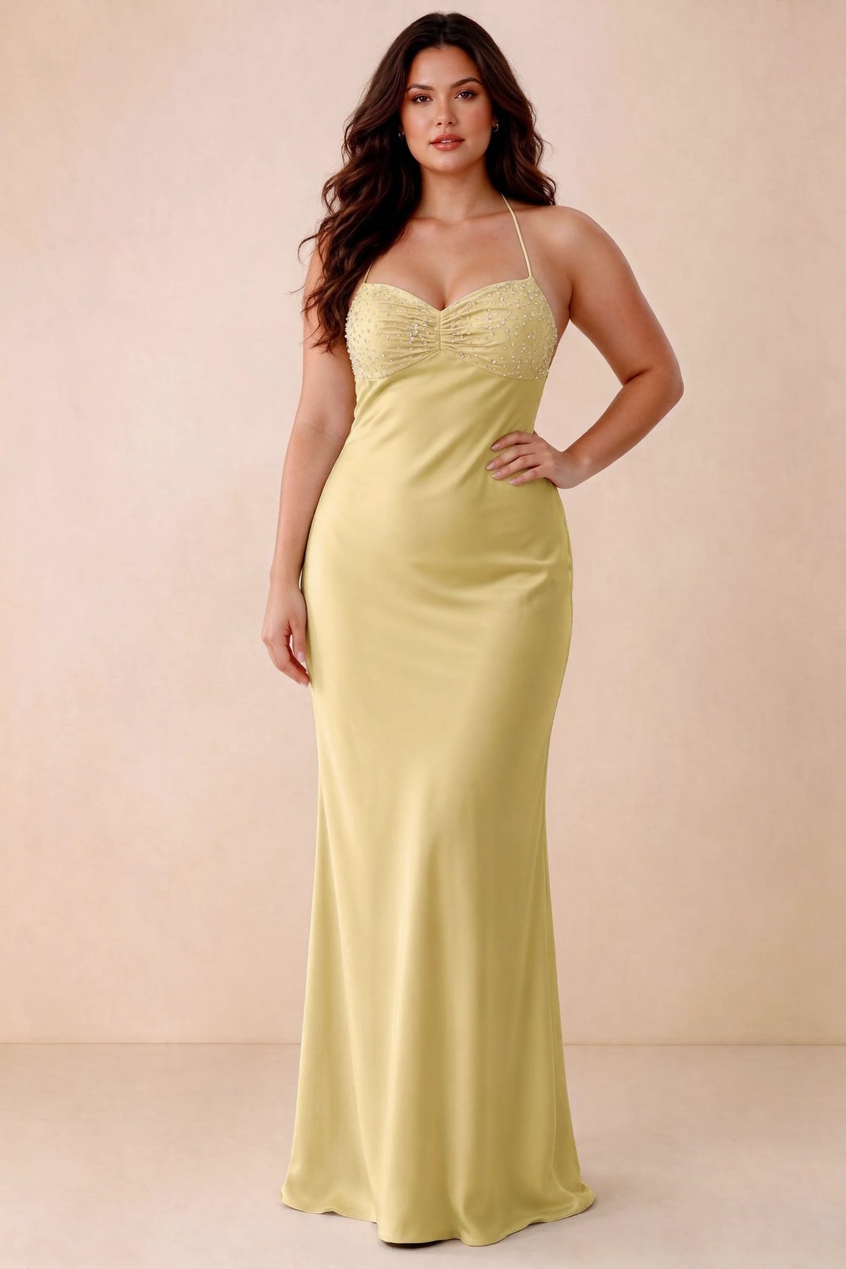 Front studio view of Blanche pastel yellow maxi dress showing the ruched beaded bodice and smooth skirt