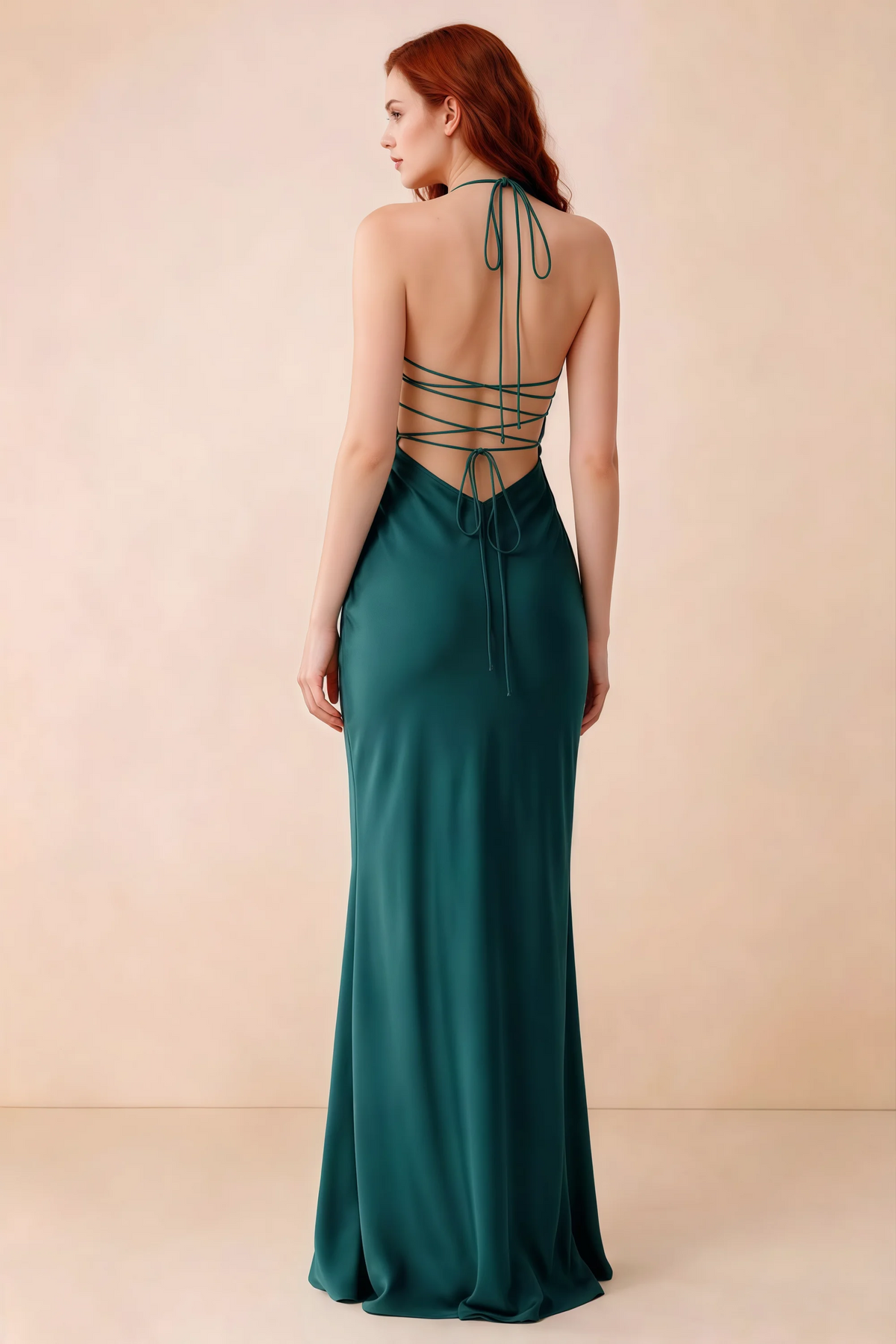Back studio view of Blanche peacock dress showing halter neck ties and crossed open-back lacing