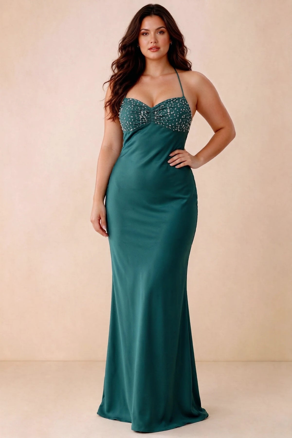 Front studio view of Blanche peacock maxi dress showing the ruched beaded bodice and smooth skirt