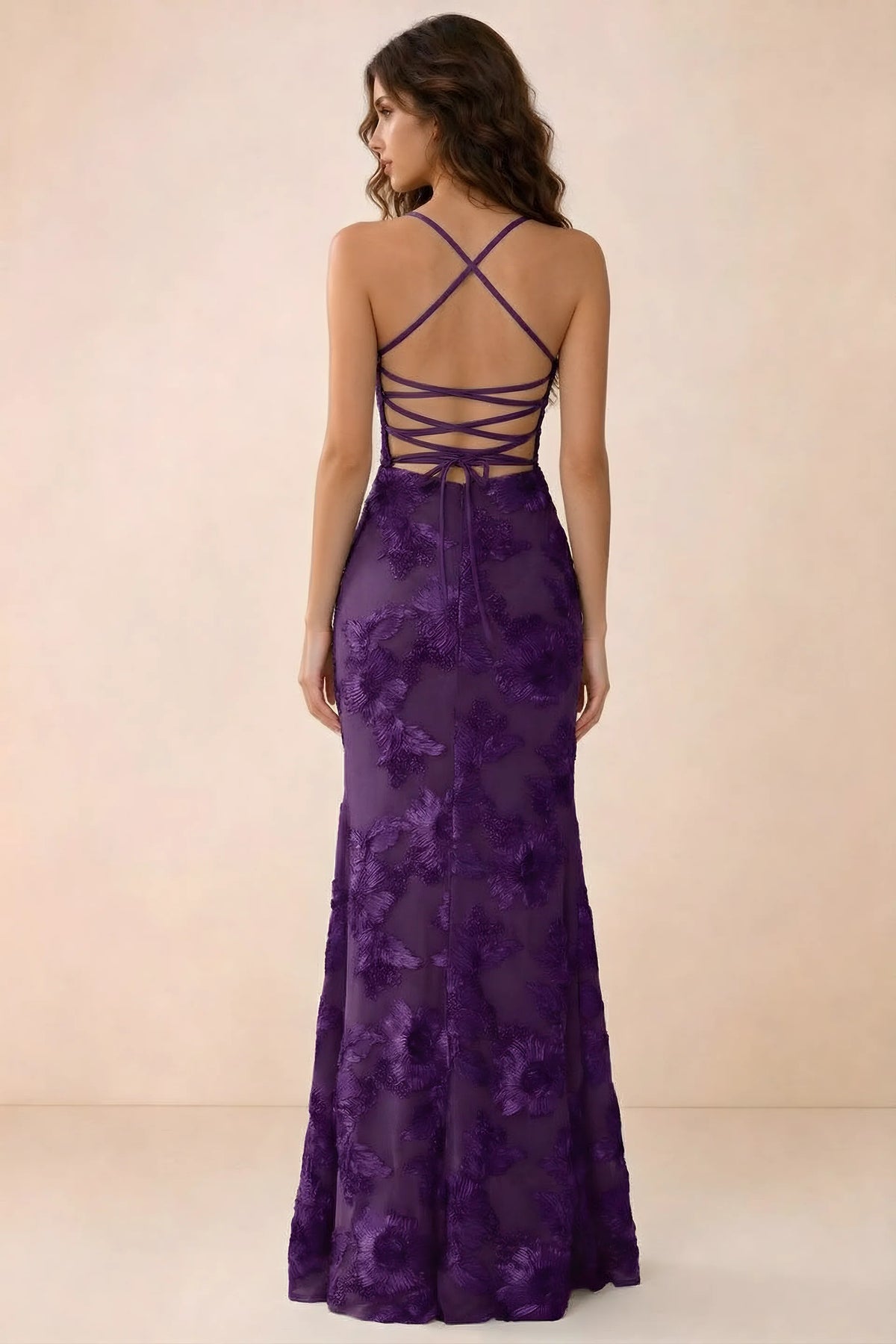 Back studio view of Belinda plum maxi dress showing crossed straps and open-back ties