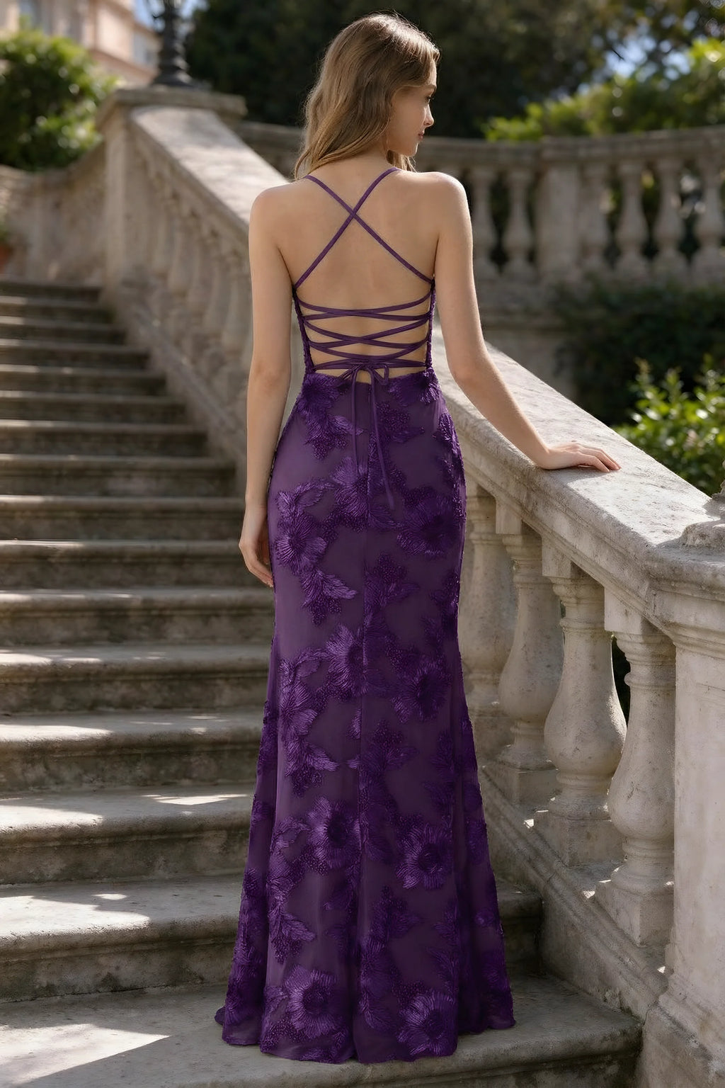 Outdoor rear view of Belinda plum mermaid maxi dress showing the crisscross back ties