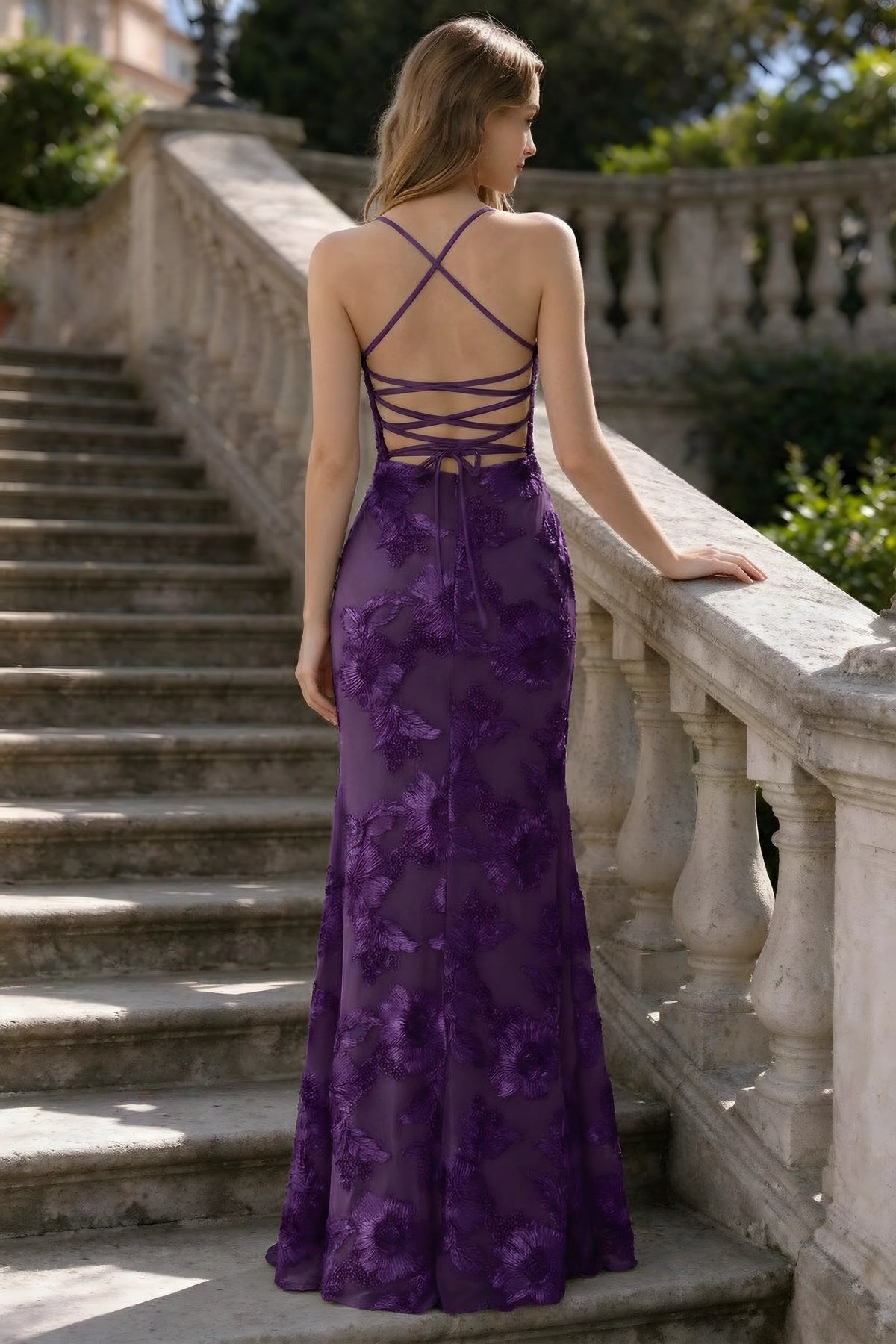Outdoor rear view of Belinda plum mermaid maxi dress showing the crisscross back ties