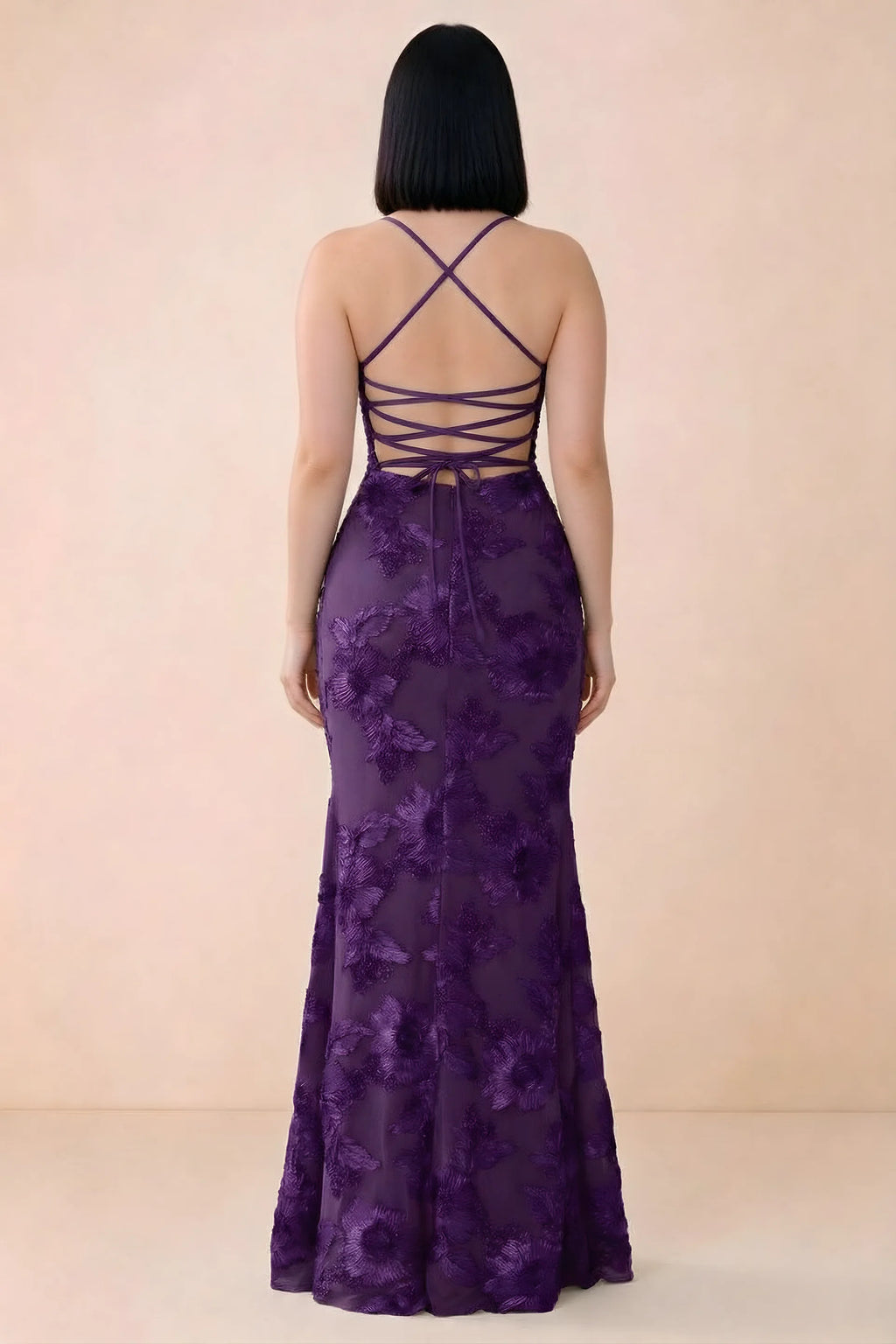 Rear studio view of Belinda plum dress showing the open back and gently flared skirt