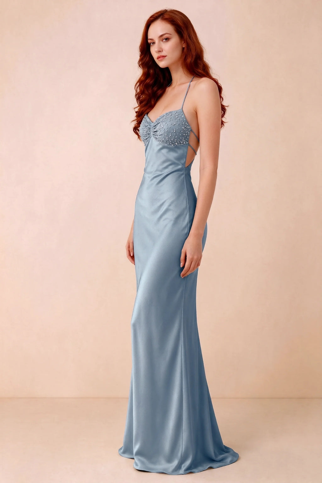 Three-quarter studio view of Blanche powder blue dress showing the fitted hips and flared long hem