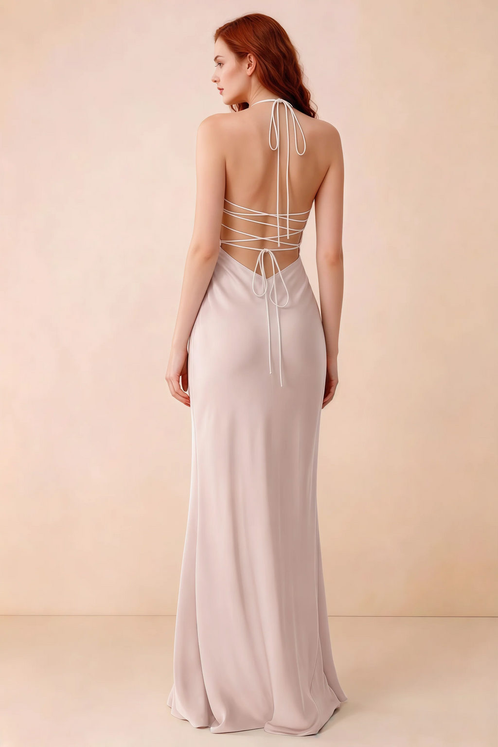 Back studio view of Blanche powder pink dress showing halter neck ties and crossed open-back lacing