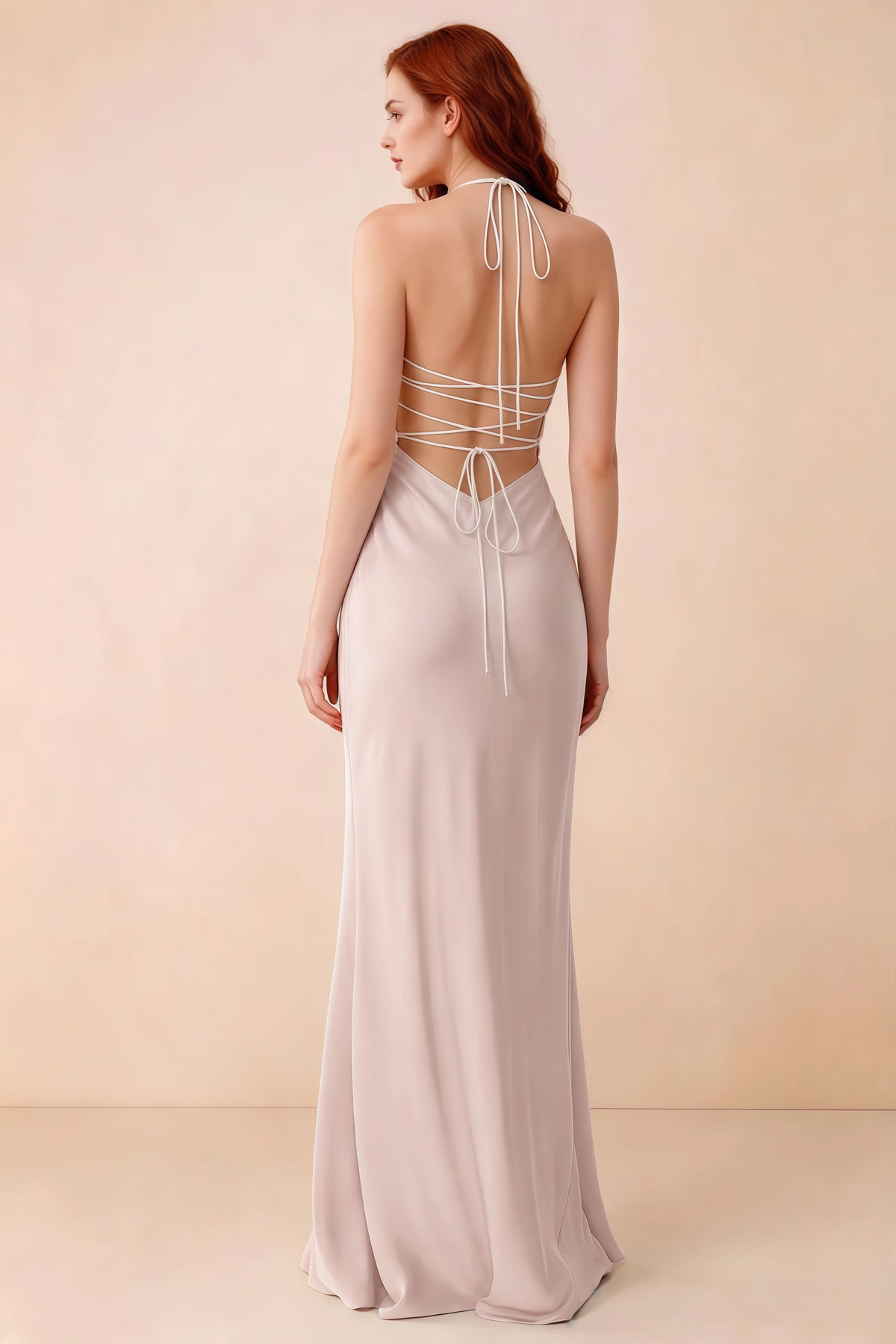 Back studio view of Blanche powder pink dress showing halter neck ties and crossed open-back lacing
