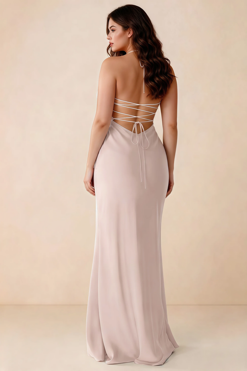 Rear studio view of Blanche powder pink satin dress showing the open back and mermaid silhouette