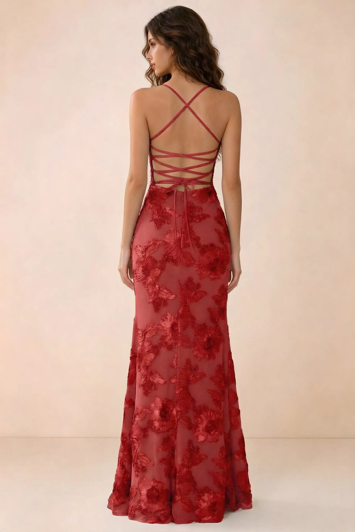 Back studio view of Belinda red maxi dress showing crossed straps and open-back ties