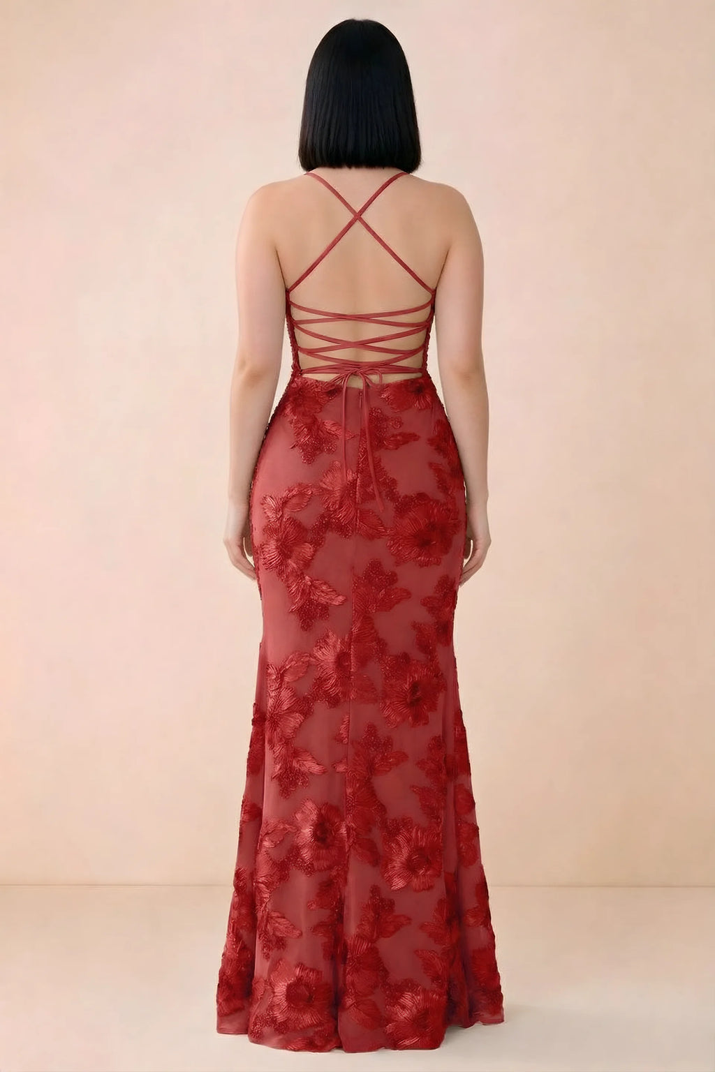 Rear studio view of Belinda red dress showing the open back and gently flared skirt