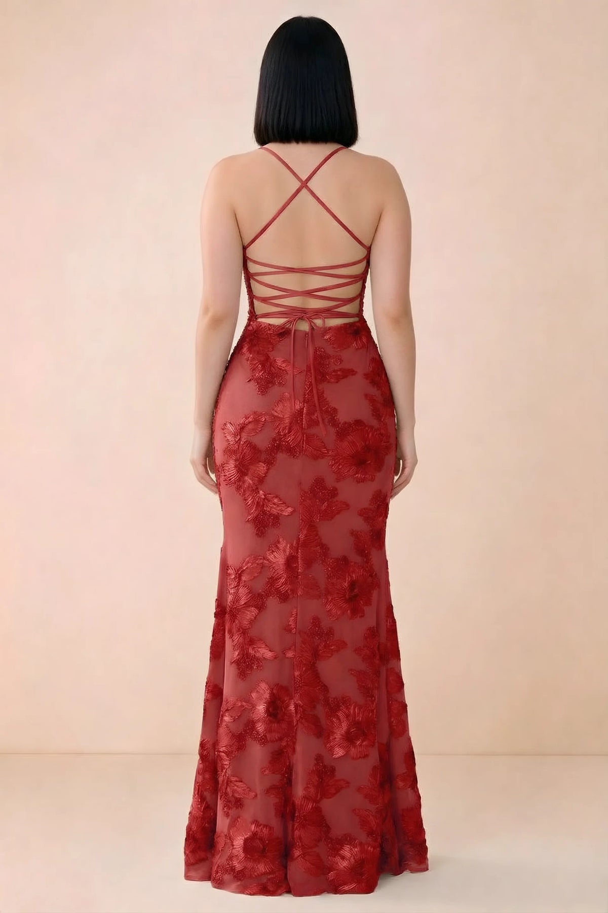 Rear studio view of Belinda red dress showing the open back and gently flared skirt