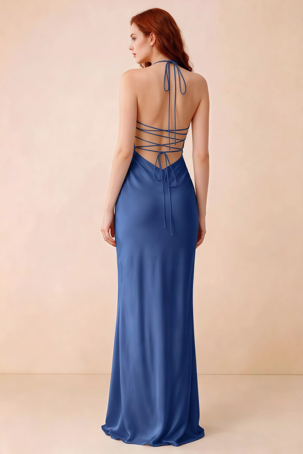 Back studio view of Blanche royal blue dress showing halter neck ties and crossed open-back lacing