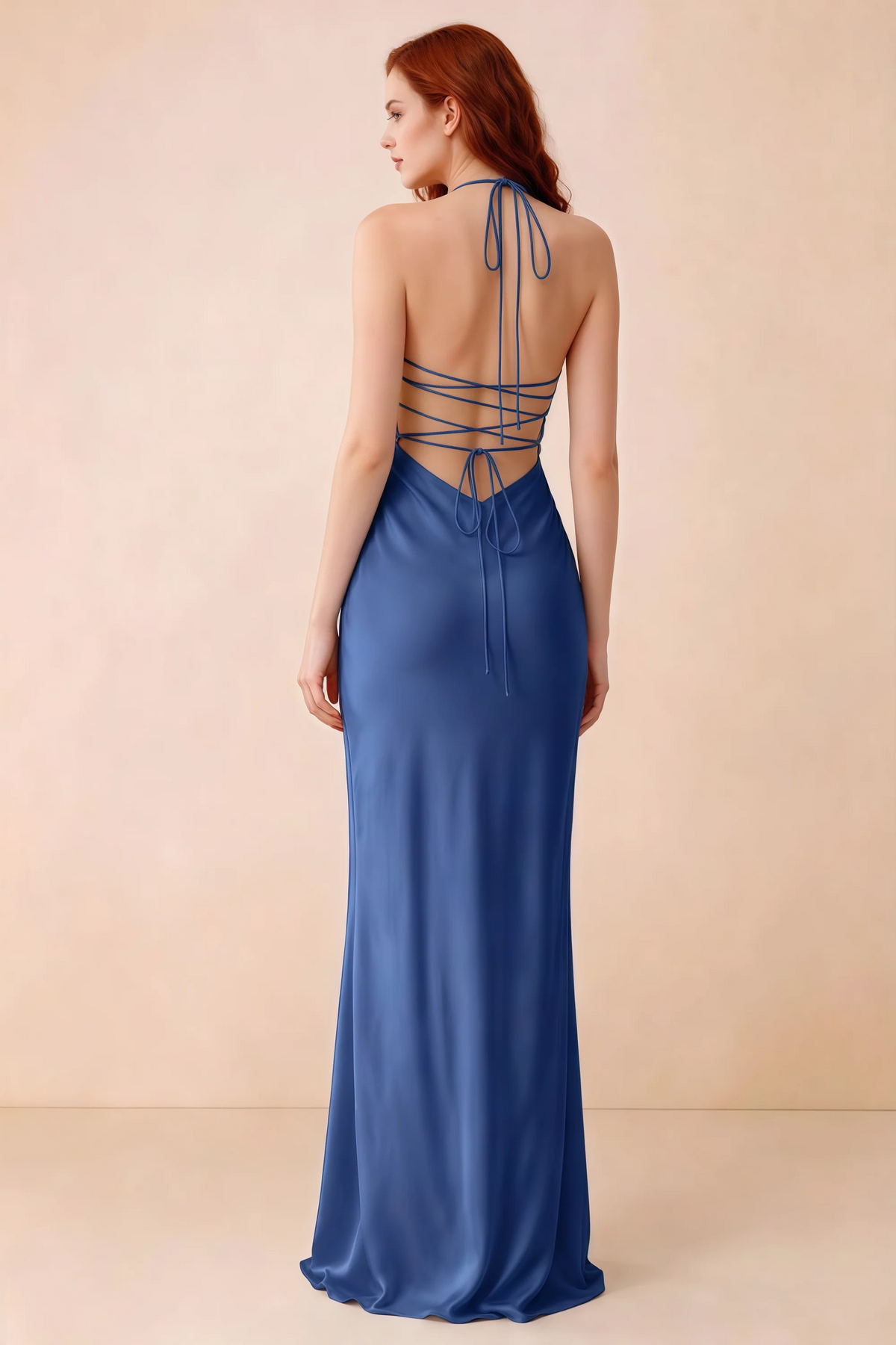 Back studio view of Blanche royal blue dress showing halter neck ties and crossed open-back lacing