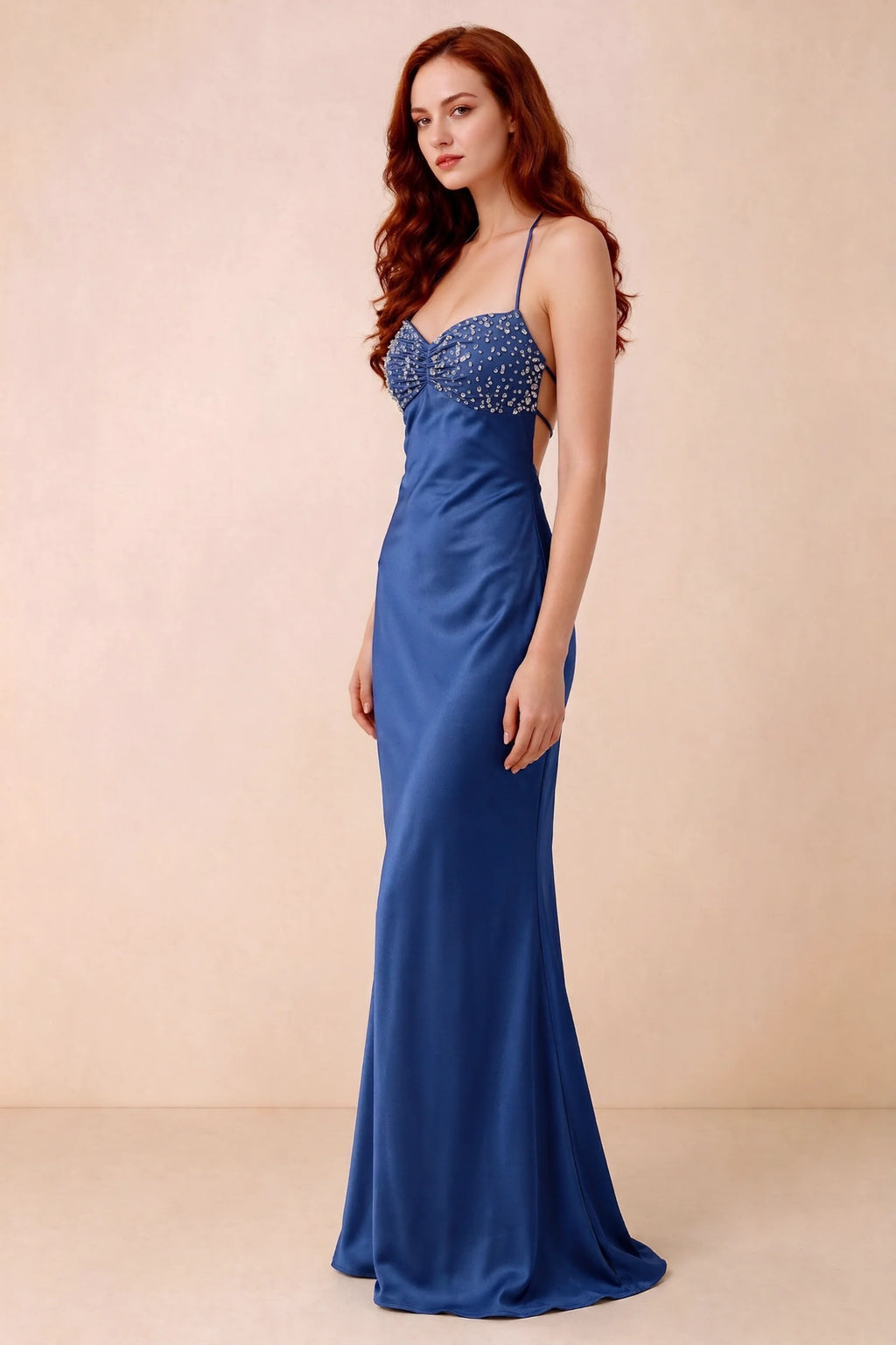 Three-quarter studio view of Blanche royal blue dress showing the fitted hips and flared long hem